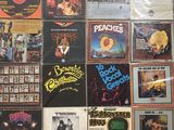 a lot of records on the wall of a room