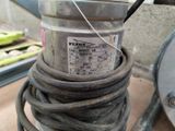 an image of a metal bucket with a hose attached to it