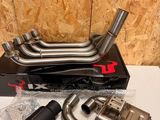 a couple of exhaust pipes sitting on top of a box
