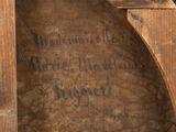 a picture of a wooden frame with writing on it