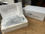 a white box with a blue toothbrush inside of it