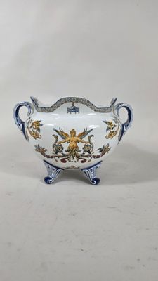 une image représentant un bol blanc orné de motifs bleus et jaunes
