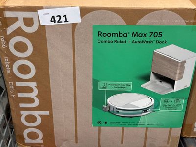 a cardboard box with a picture of a roomba on it