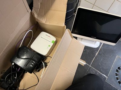 a box with a laptop and a monitor inside of it