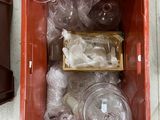 a box of empty plastic bottles and plastic cups in it