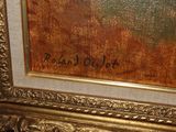 a picture of a painting on a wall with writing on it