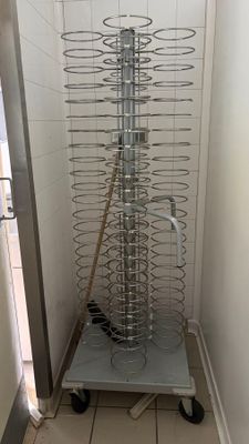 an image of a kitchen with a rack of food on the floor