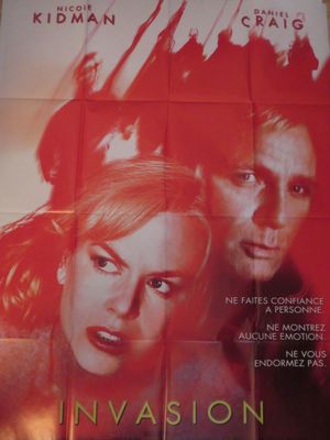 l'affiche du film « Invasion », mettant en scène deux femmes et un homme