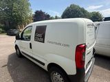 a white van that is parked in a parking lot