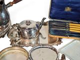 a lot of silver items that are on the table