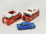 three toy cars that are on top of a box
