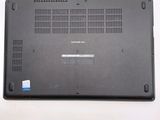 a laptop that is sitting on a white surface