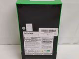the back of a box with a green lid on a white surface