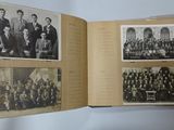 an old photo of a group of men posing for a picture