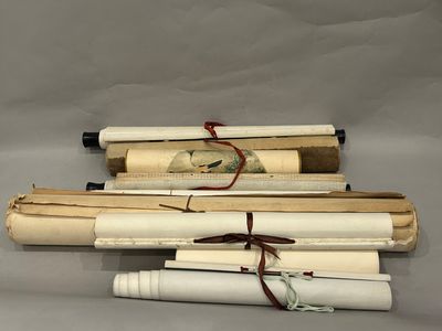 three old books are stacked on top of each other on a table