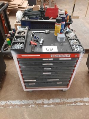 a workbench with tools on top of it in a garage