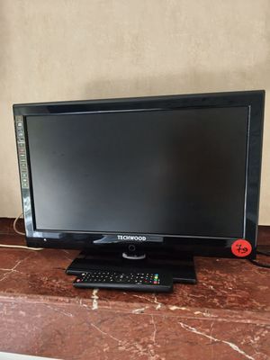 the monitor is on the counter next to the keyboard and mouse