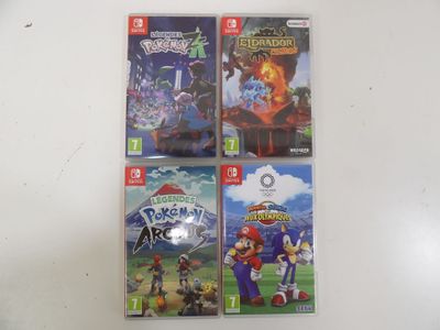 four nintendo wii games are on a table with a white background