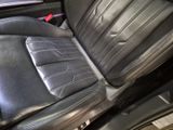 a black leather seat in the back of a car