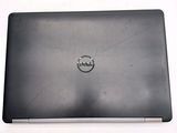 a dell laptop with a dell logo on the screen
