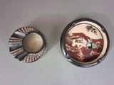 two ashtrays sitting next to each other on a table