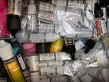 many different types of glues and paint in this box