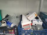 a pile of items in a blue crate in a room