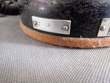 a close up of a guitar case on a table