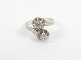 a close up of a silver ring on a white surface
