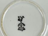 a close up of a plate with a flower on it