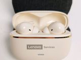 a pair of earphones in a case on a white surface