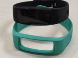 two wristbands that are sitting on a table