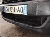 a car that has a license plate on the front of it