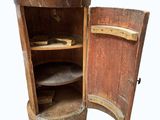 an old wooden cabinet with a marble top