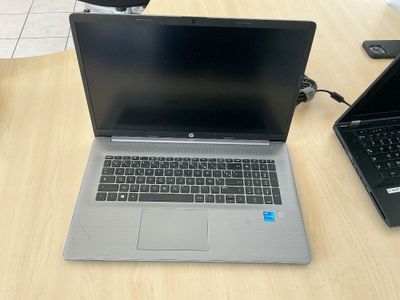two laptops that are sitting on a table