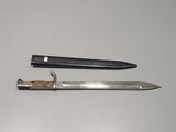a knife and a knife holder sitting on a table