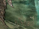 a picture of a green bag with coins on it