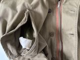 a person wearing a jacket that has a zipper on it