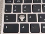 a close up of a computer keyboard with a broken key