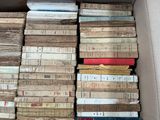 a box full of old books sitting on the floor