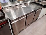 a stainless steel counter in a kitchen with a lot of counter space