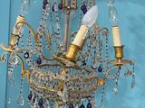 a chandelier hanging from the ceiling in a room