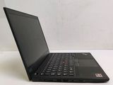 a black laptop computer sitting on a white table