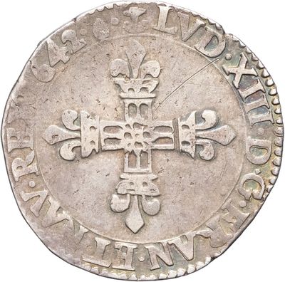 une image représentant une pièce d'argent sur laquelle figure une croix