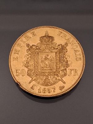 an image of a gold coin with a coat of arms on it