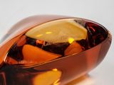 a glass object that is shaped like a boat
