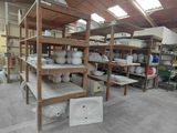 a room filled with lots of pottery on shelves