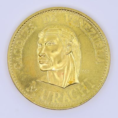 gold coin with a portrait of a man ' s head on it