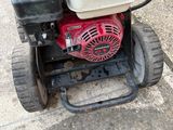 a small machine that is sitting on the sidewalk