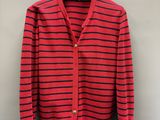 a red and black striped cardigan sweater hanging on a hanger